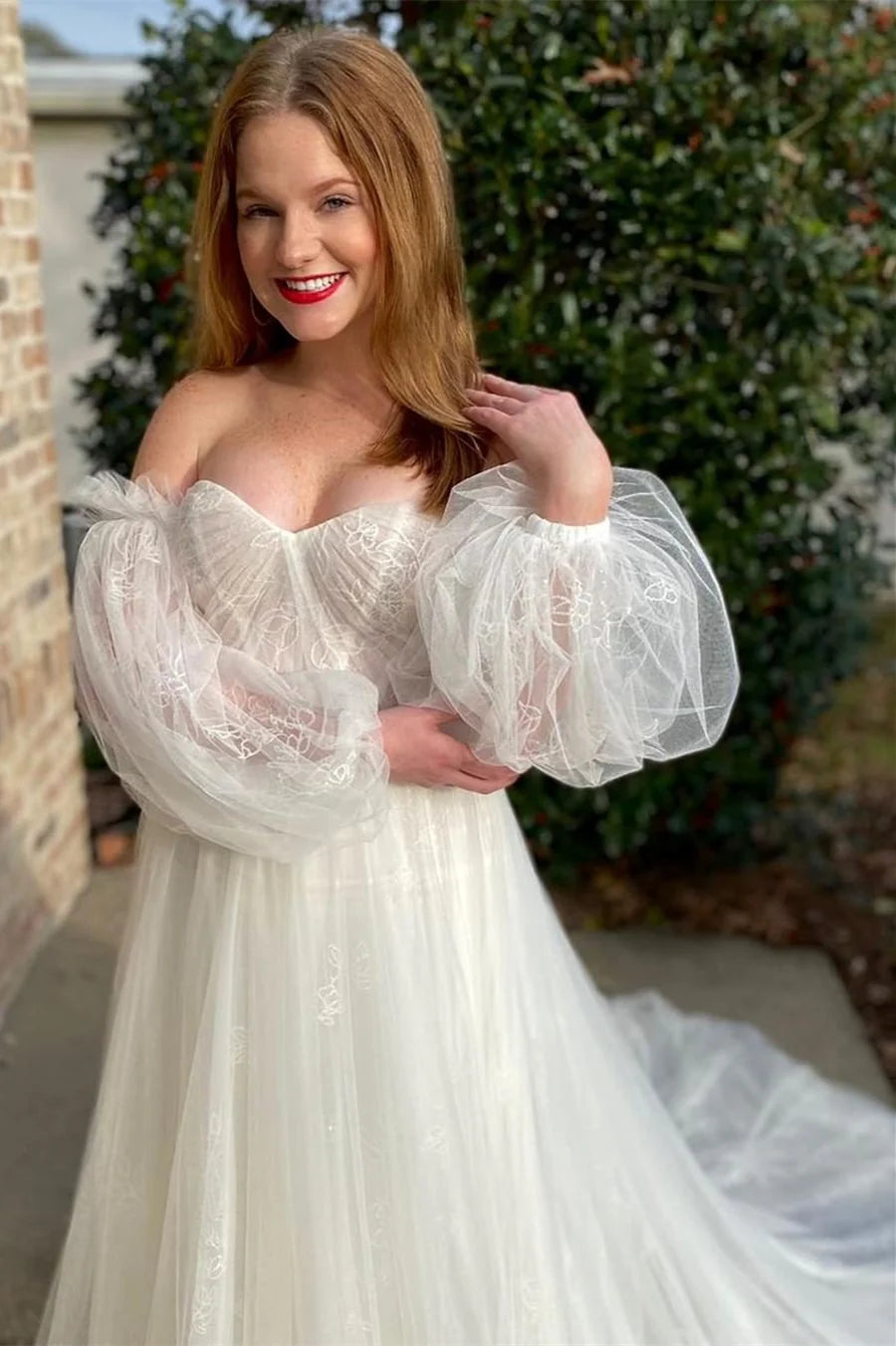 Vestido de novia largo sin tirantes y con cola